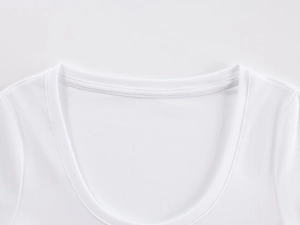 Close-up of a white U-neck T-shirt showing fine ribbed collar and high-quality fabric detail