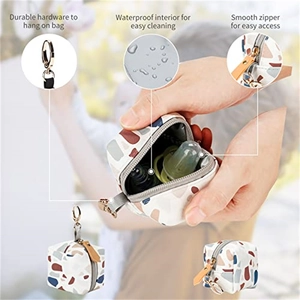 Detail of multi-color pebble textured mini bag showing waterproof lining and metal hardware