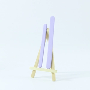 Macro detail of two light purple reusable silicone stirring sticks for DIY resin art molding