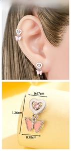 Detail view of pink heart and butterfly stud earring with 1.26cm size dimensions