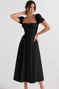 Detail of a black French vintage high waist dress with puff sleeves and square neckline
