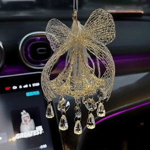 Golden bow car mirror ornament with white feathers and sparkling crystal glass drops
