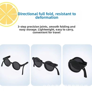 Three-step folding mechanism of round kids sunglasses in black with foldable frame