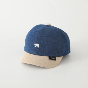 Close-up of baby baseball cap with white polar bear embroidery and navy blue cotton fabric