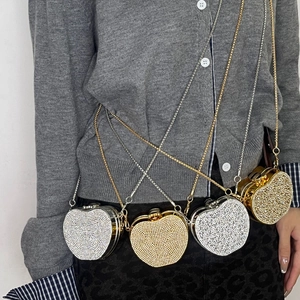 Sparkling heart-shaped rhinestone evening bags in gold and silver with metal chain straps