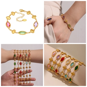 Detail of gold stainless steel heart bracelet featuring multi-color marquise crystals
