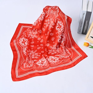 Fashionable red paisley and polka dot square silk scarf for women displayed on white background