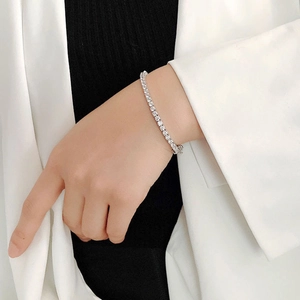 Silver tennis bracelet with sparkling cubic zirconia on model for a hip hop fashion style