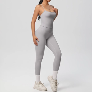 Detail of grey seamless yoga set featuring thin strap sports bra and high-waisted leggings