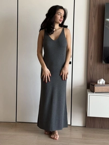 Detailed texture of grey knit maxi slip dress with high elasticity and elegant V-neckline