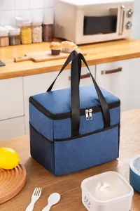Close-up of large blue insulated lunch bag featuring woven texture and side mesh pocket