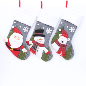 Three grey felt Christmas stockings with 3D Santa, snowman, and polar bear decorations