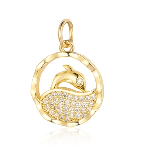 Macro shot of gold dolphin pendant with pave-set cubic zirconia on wavy round frame