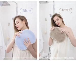 Detail view of large silicone foot scrub pads with hanging holes in blue and brown colors