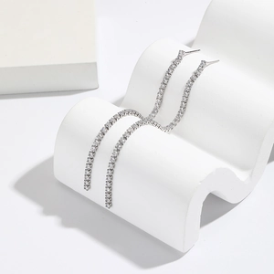 Luxurious S925 silver fringe earrings with square zircon stones on a white stand