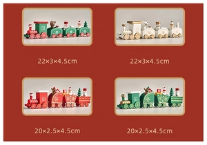 Detail view of colorful wooden Christmas train ornaments with festive painted characters