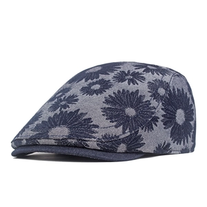 Close-up of daisy jacquard denim fabric texture and pattern on a stylish newsboy cap