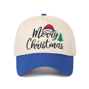 Close-up of Merry Christmas embroidery on a blue and beige color-block baseball cap