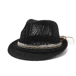 Ethnic hollow knit jazz fedora hat in black with sequin band and tassel trim detail