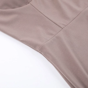 Detailed macro view showing the precise stitching and pink knitted elastic fabric texture
