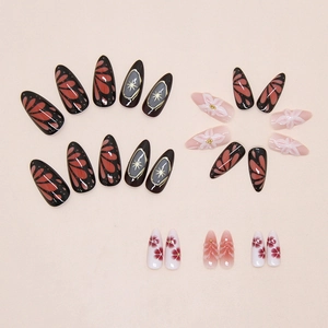 Macro view of press-on nails featuring 3D floral reliefs and sparkling star patterns