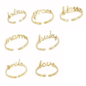 7-piece set of 18K gold plated stainless steel adjustable rings with positive script words