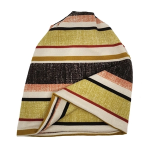 Detailed view of the soft knitted texture and colorful striped pattern on the beanie
