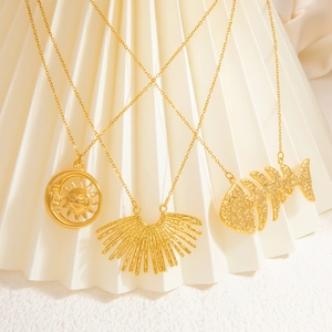 Three 18k gold stainless steel necklaces with sun moon, fan, and fishbone pendants