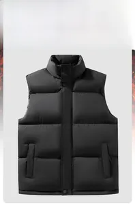 Detail of black quilted puffer vest featuring stand collar and metal button closures