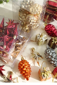 Close-up of assorted Nordic Christmas tree ornaments including pine cones and stars