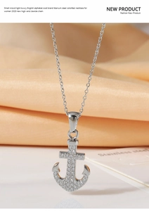 Detail of silver titanium steel anchor pendant with micro-pave cubic zirconia crystals