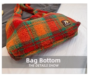 Detail view of the thick bottom and plaid wool texture of the large tote bag