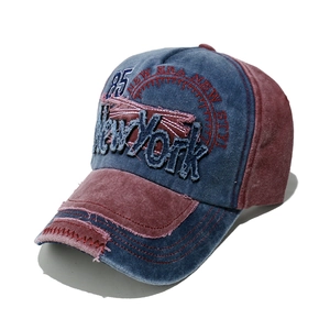 Detail of vintage navy and burgundy baseball cap with New York patch and embroidery