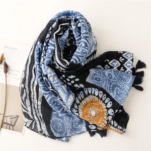 Ethnic blue patterned scarf with black tassels and bohemia totem print on white background