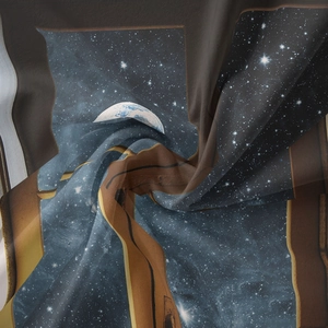 Macro shot of semi-transparent bohemian tapestry with blue star nebula and planet prints