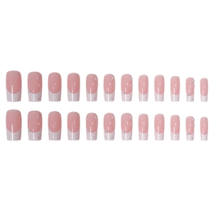 French tip press-on nails in pink with white tips and pearl accents on white background