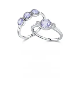 Macro detail of S925 sterling silver ring featuring a light purple round gemstone
