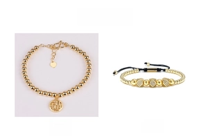 Detailed view of 14k gold-filled beads bracelet with a Chinese Fu character pendant