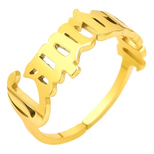 Detail of gold-plated stainless steel adjustable ring with gothic BABY letter cutout design