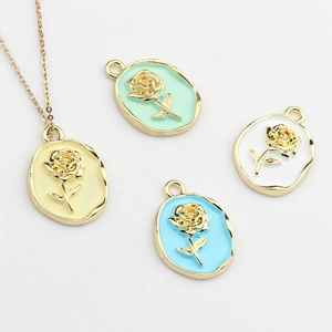 Detailed macro view of enamel rose pendants in assorted pastel colors with gold frames