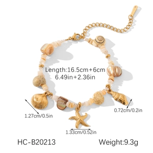 Detail view of a gold shell and starfish bracelet with length and weight measurements