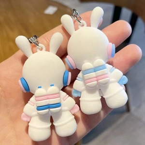 Cute astronaut space rabbit silicone keychains in blue and pink for school bags