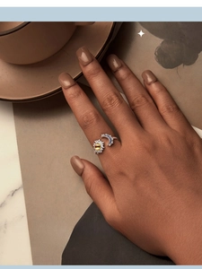 Detailed view of Sun and Moon S925 silver ring featuring sparkling blue and yellow stones