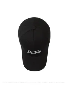 Top view of a black baseball cap featuring white Sweet cursive embroidery on canvas fabric