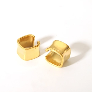 Detailed close-up of 18K gold plated stainless steel ear cuffs with irregular texture