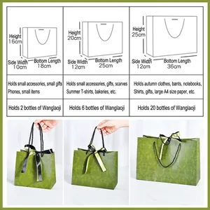 Three sizes of green vintage luxury gift bags with black ribbon and floral patterns