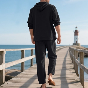 Men black linen beach set with hooded long sleeve shirt and trousers in outdoor scenery