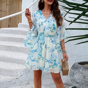 White floral chiffon dress with V-neck, ruffle sleeves and tie-waist in a resort style