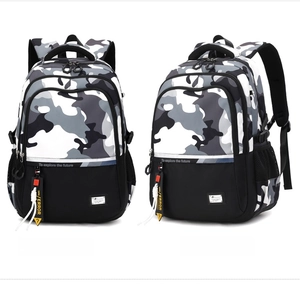 Detail of camouflage backpack featuring reflective straps and functional side mesh pockets