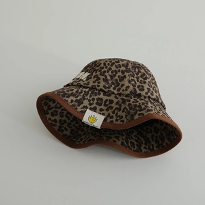 Close-up of leopard print bucket hat with Boston embroidery and durable brown edge binding
